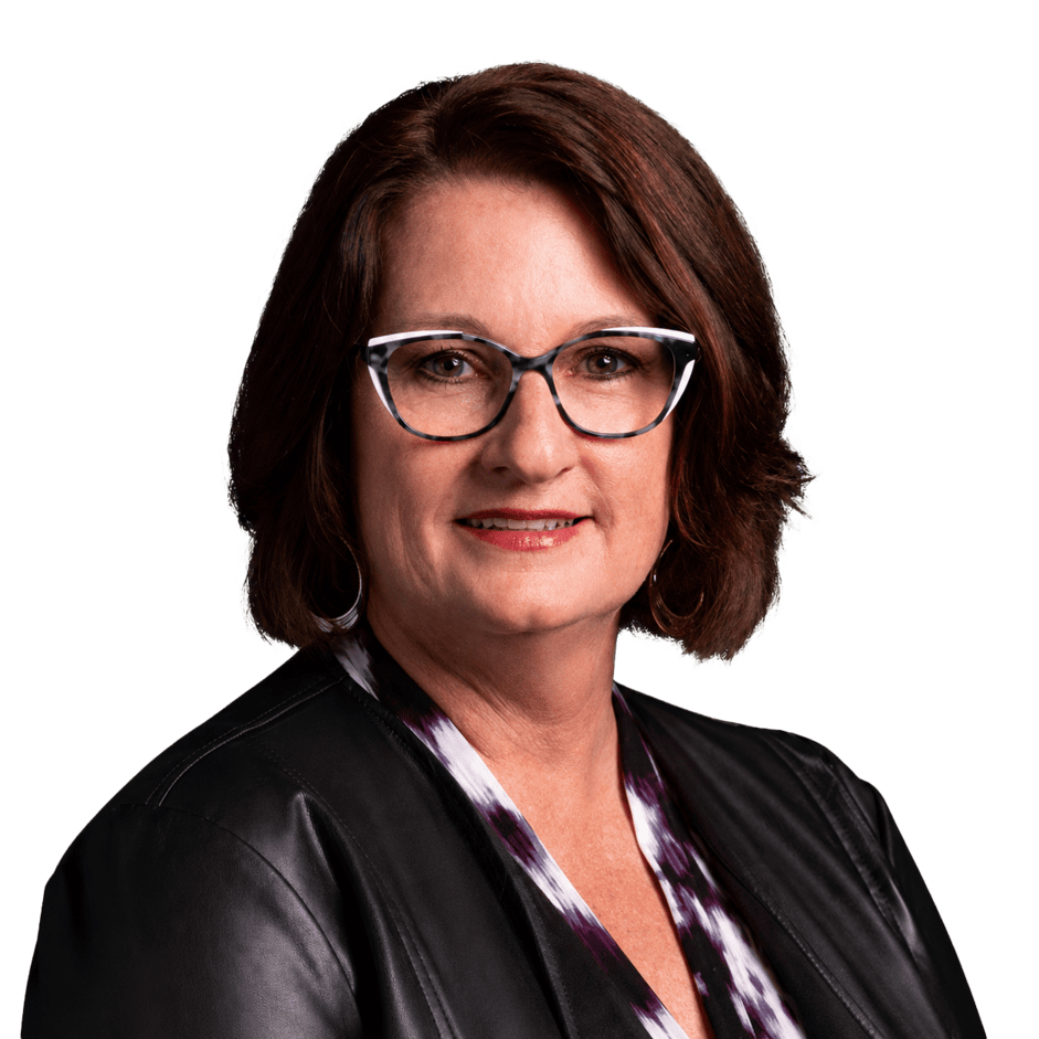 Professional woman with glasses and brown hair, wearing a black leather jacket, smiling confidently.